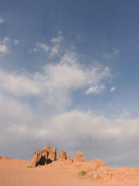 Rock formations in desert against sky