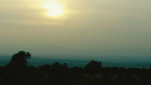 Scenic view of landscape against sky during sunset