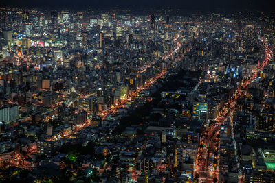 Aerial view of illuminated cityscape at night