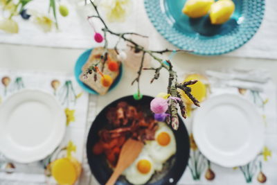 High angle view of decoration over breakfast at table