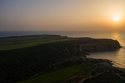 Scenic view of sea against sky during sunset