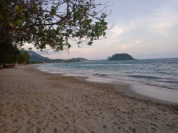 Scenic view of beach against sky during sunset