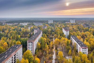 Ukraine, kyiv oblast, pripyat, aerial view of abandoned city at autumn sunset