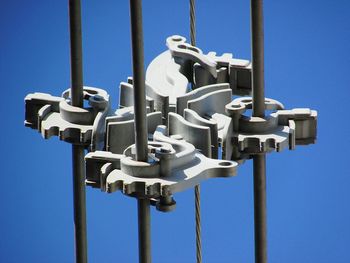 Low angle view of pole against blue sky