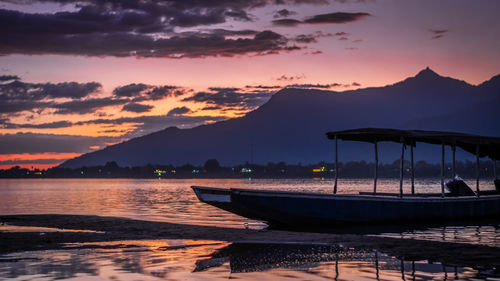 Scenic view of lake against sky during sunset