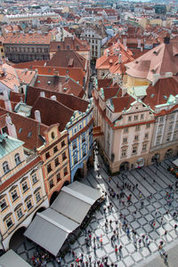 High angle view of people on street amidst buildings in town