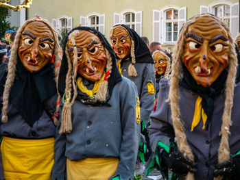 Midsection of women wearing mask in city