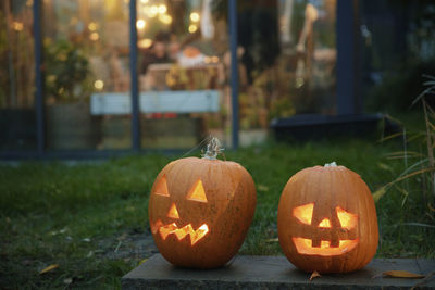 Carved jack-o-lanterns in garden