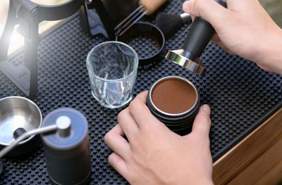 Cropped hands of woman preparing food on table