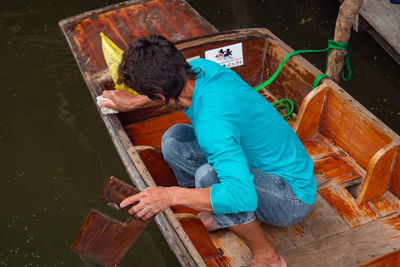 High angle view of man working on wood