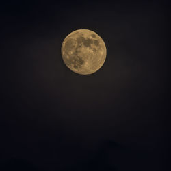 Low angle view of full moon in sky