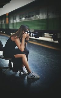 Young woman sitting in bus