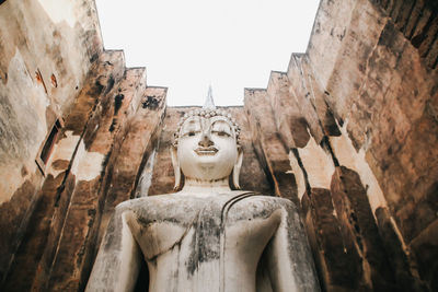 Low angle view of statue against sky