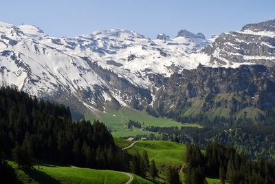 Scenic view of snowcapped mountains against sky