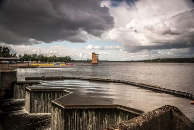 Scenic view of building against cloudy sky