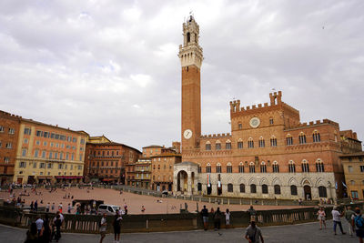 Palazzo pubblico palace and torre del mangia tower in the historic center of siena, tuscany, italy