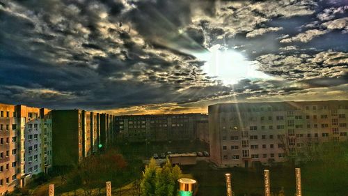 Panoramic shot of cityscape against sky during sunset