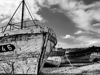 View of sailboat moored in sea against sky