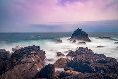 Scenic view of sea against sky at sunset