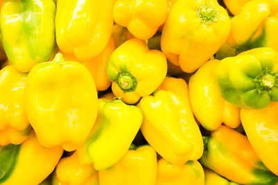 Full frame shot of yellow bell peppers for sale in market