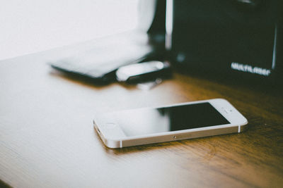 Close-up of mobile phone on table