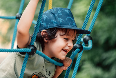 Close-up of boy looking at playground