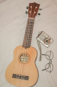 High angle view of guitar on table