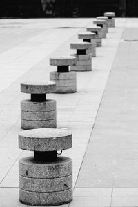 Empty seats arranged on footpath