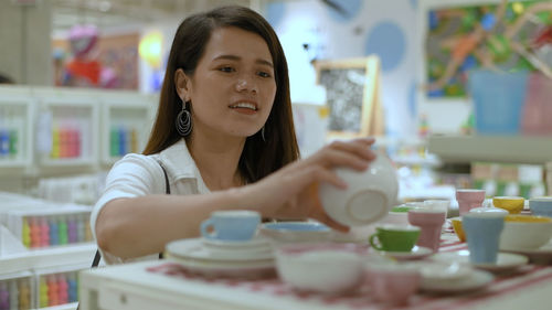 Portrait of woman holding ice cream