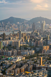 Aerial view of hong kong cityscape against sunset light