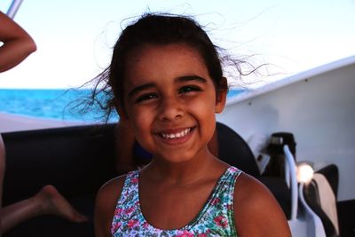 Portrait of smiling cute girl at beach
