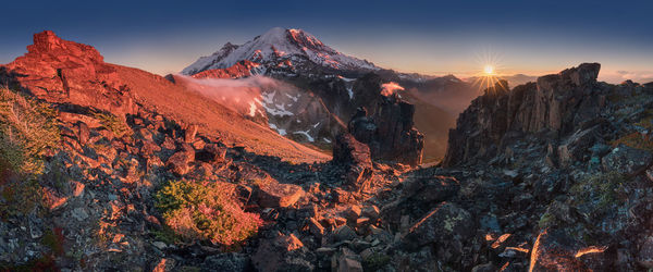 Panoramic view of rocks against sky during sunset