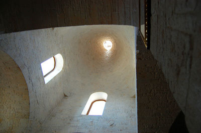 Low angle view of illuminated lamp