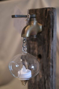 Close-up of wineglass against wall