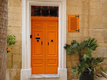 Traditional vintage painted wooden door and exterior in malta. entrance to typical maltese houses.