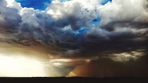 Low angle view of dramatic sky during sunset