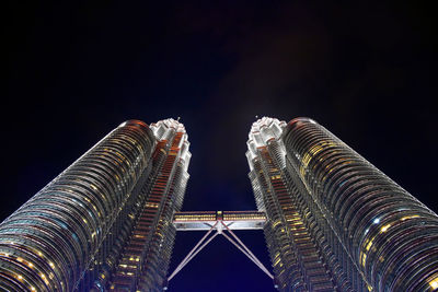 Spires of the petronas twin towers with cloudy background during a rainy day