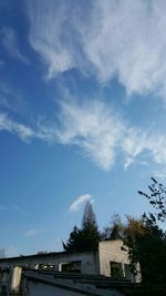 Built structure against blue sky and clouds