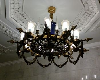 Close-up of illuminated chandelier against sky