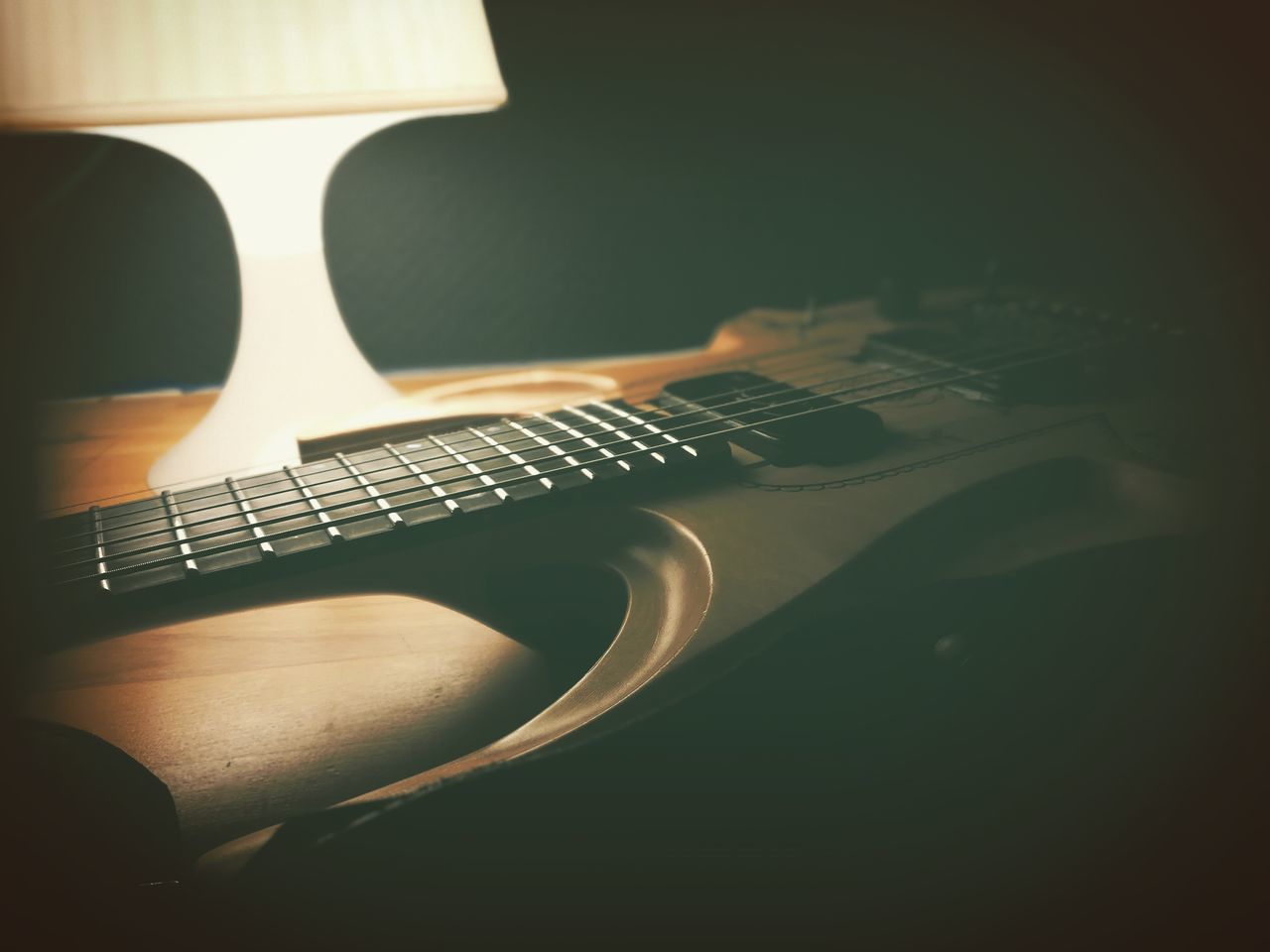 HIGH ANGLE VIEW OF GUITAR PLAYING PIANO