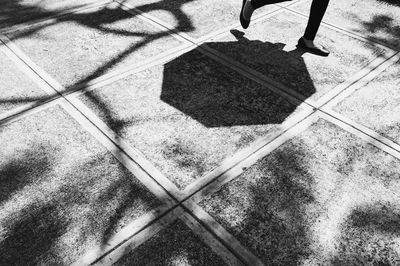 Low section of man on shadow