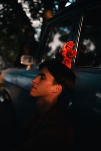 Portrait of man sitting in car