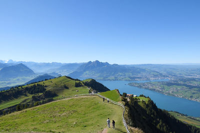 Scenic view of mountains against clear blue sky