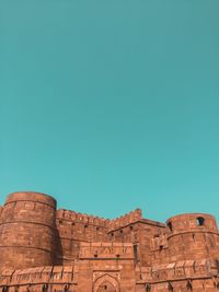 Low angle view of historical building against blue sky