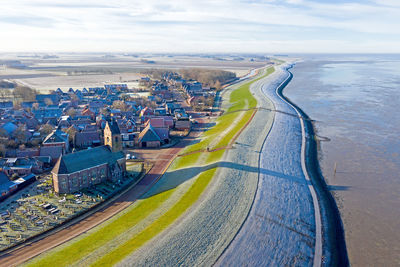 Aerial from the village wierum on a beautiful winter day in the netherlands