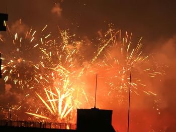 Firework display at night