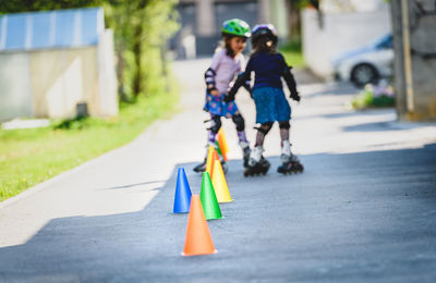 Girls skating on road