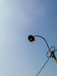 Low angle view of street light against sky