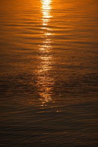 Reflection of sky in sea during sunset