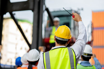 Rear view of people working